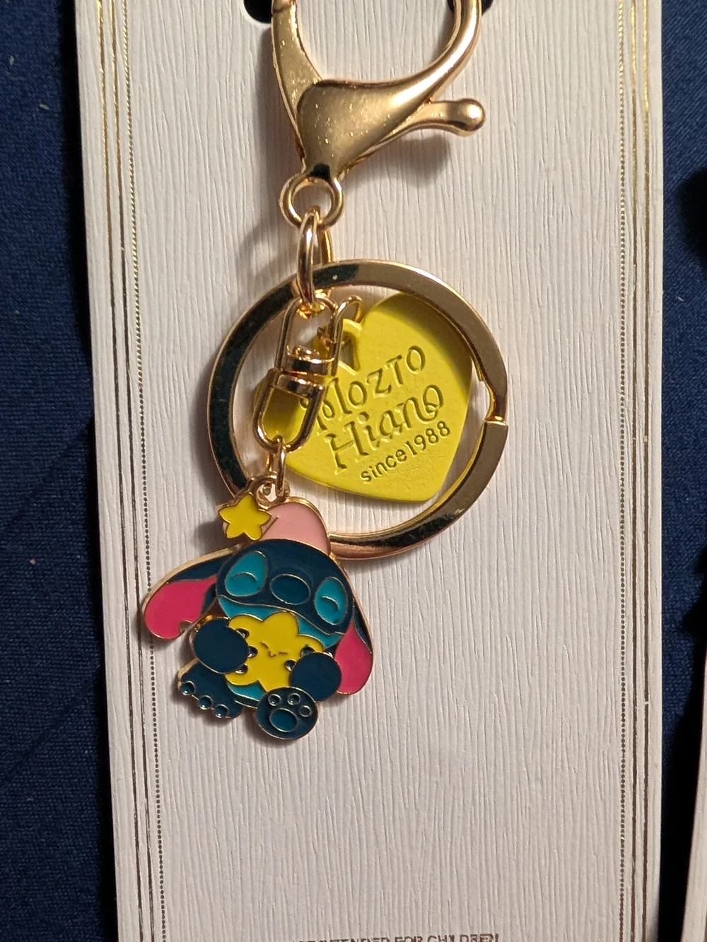 4 New Gold Keychain with Blue and Pink Stitch Character